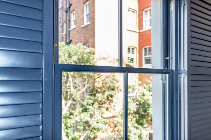 British-made-sash-window-with-wooden-shutters-1024x683