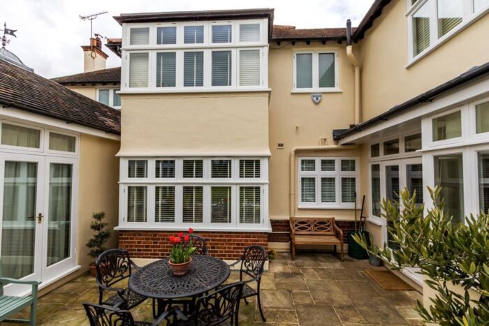 Garden-view-of-house-with-large-timber-casement-windows-Ernle-Road-Wimbledon-1024x683