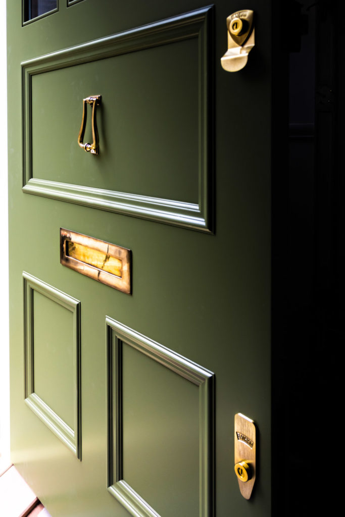 Ruvigni-Gardens-Brass-Front-Door-Furniture-on-Green-Door-683x1024