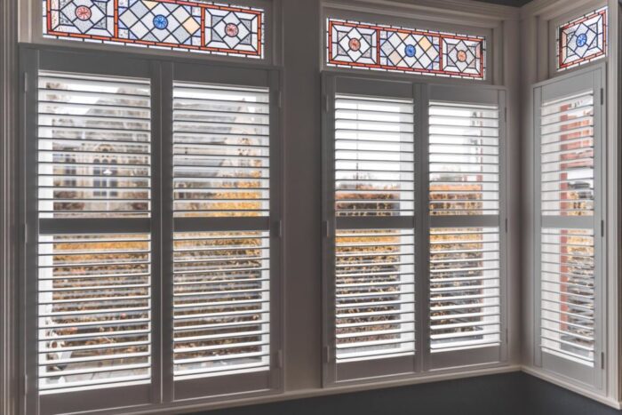 Wooden-Bay-Window-with-Stained-Glass-and-Plantation-Shutters-1024x683